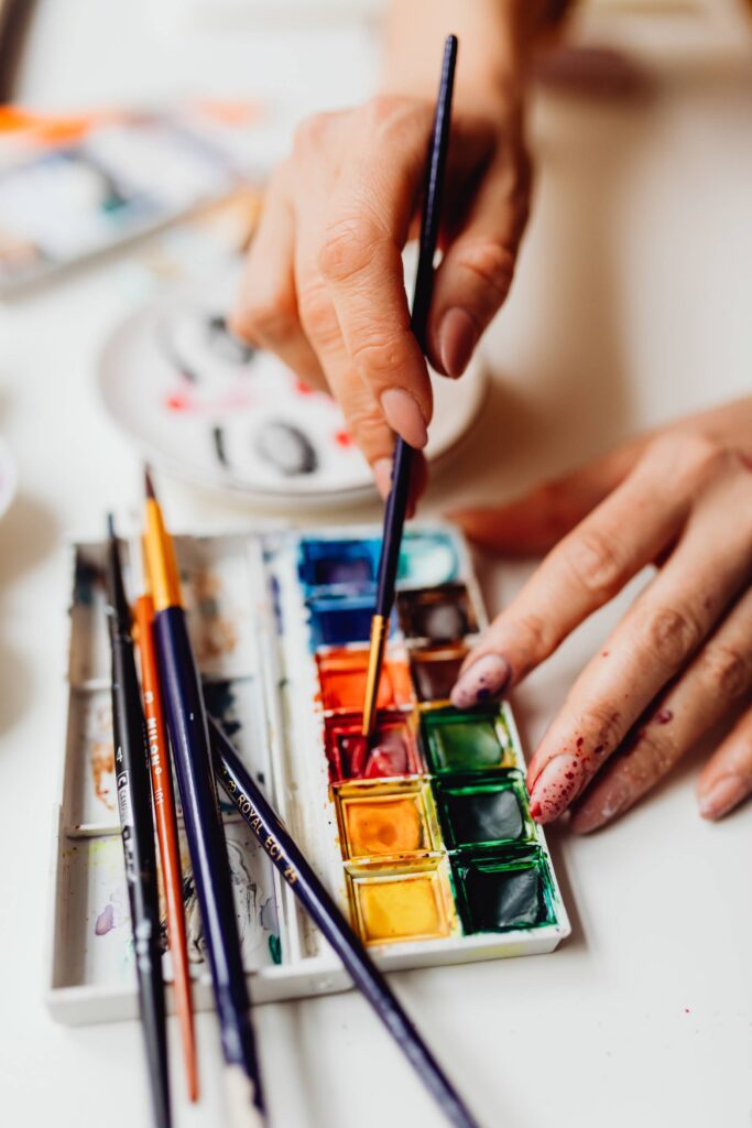 Woman Painting with Watercolors Free Photo