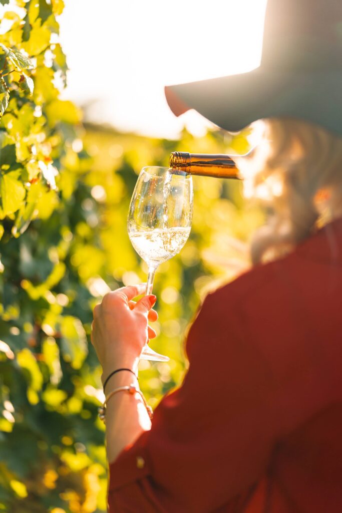 Woman Pouring Wine Free Photo