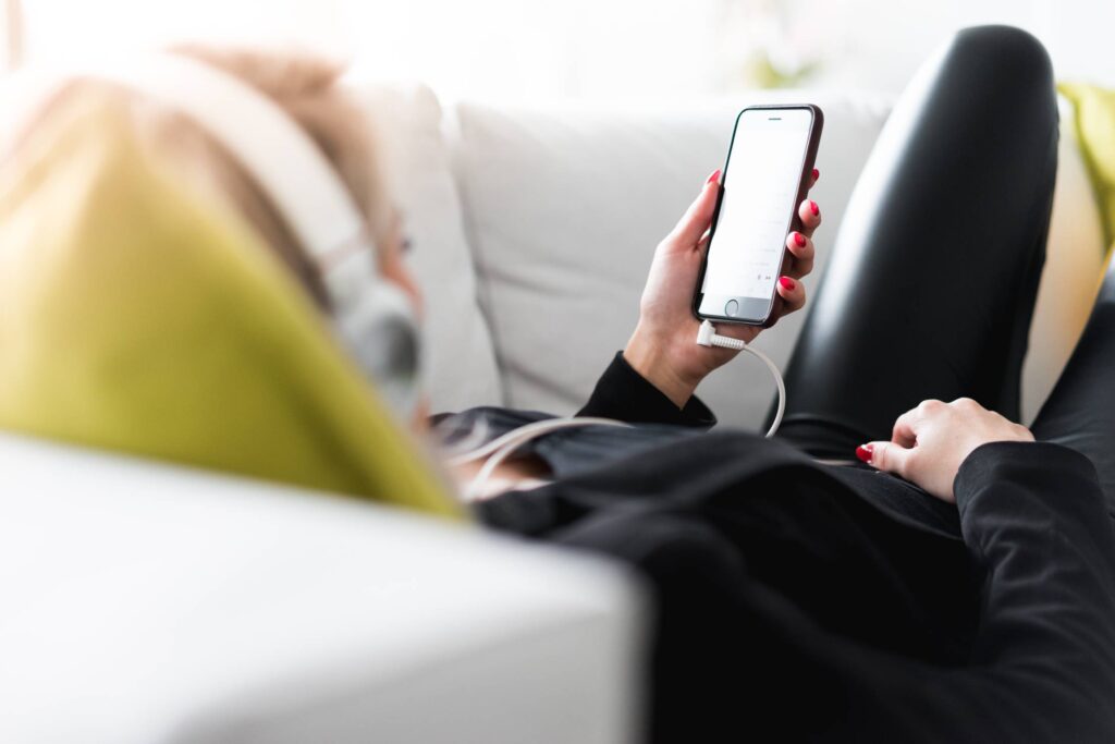 Woman Relaxing and Listening to Streamed Music Free Photo