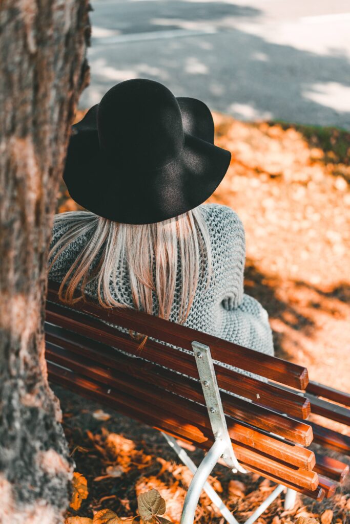 Woman Sitting on a Bench Back View Free Photo