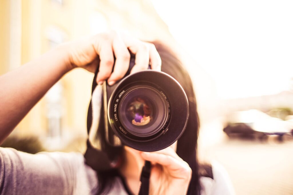 Woman Taking a Photo with DSLR Free Photo