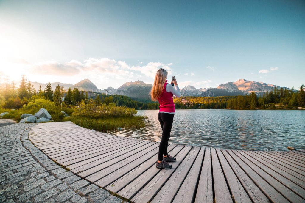 Woman Traveler Taking a Photo of Tremendous High Tatras, Slovakia Free Photo