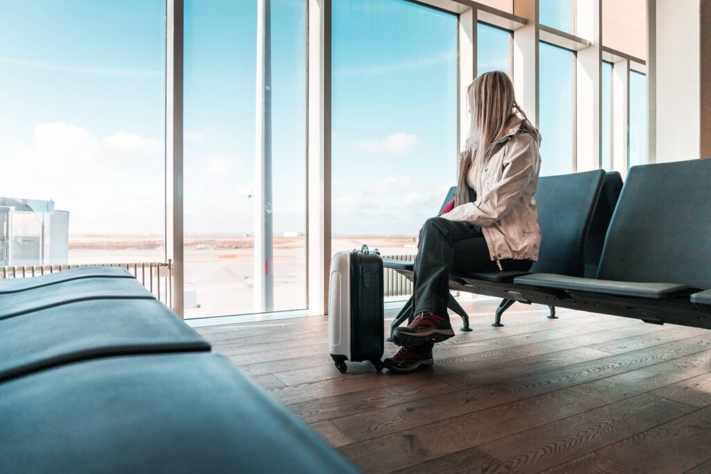 Woman Traveler Waiting at Icelandic Airport Free Photo