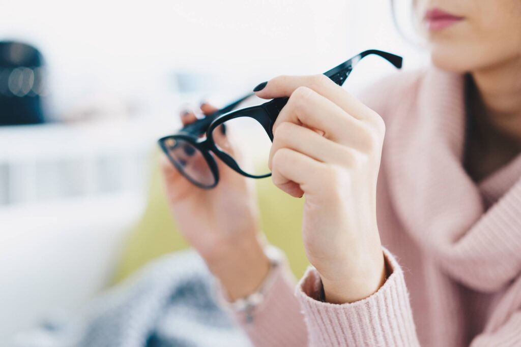 Woman Trying Eyeglasses in Optical Store Free Photo