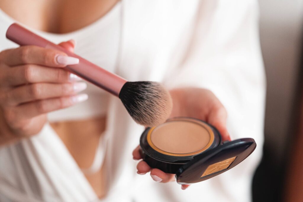 Woman Using Make Up Powder Brush Free Photo