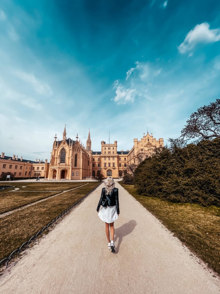 Woman Walking in Lednice Park to Visit Lednice Castle, Czechia Free Photo