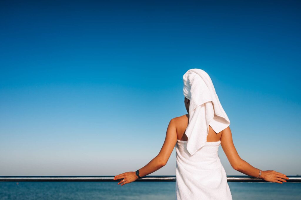 Woman Watching The Sea after Morning Shower Free Photo