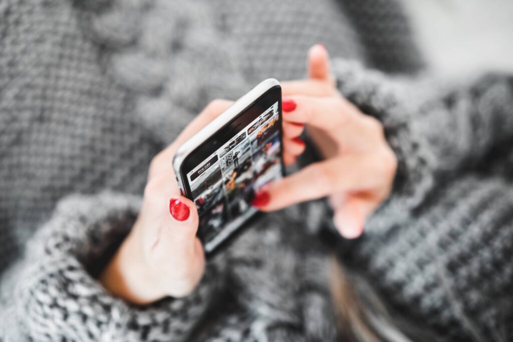 Woman with Smartphone in Hands Free Photo