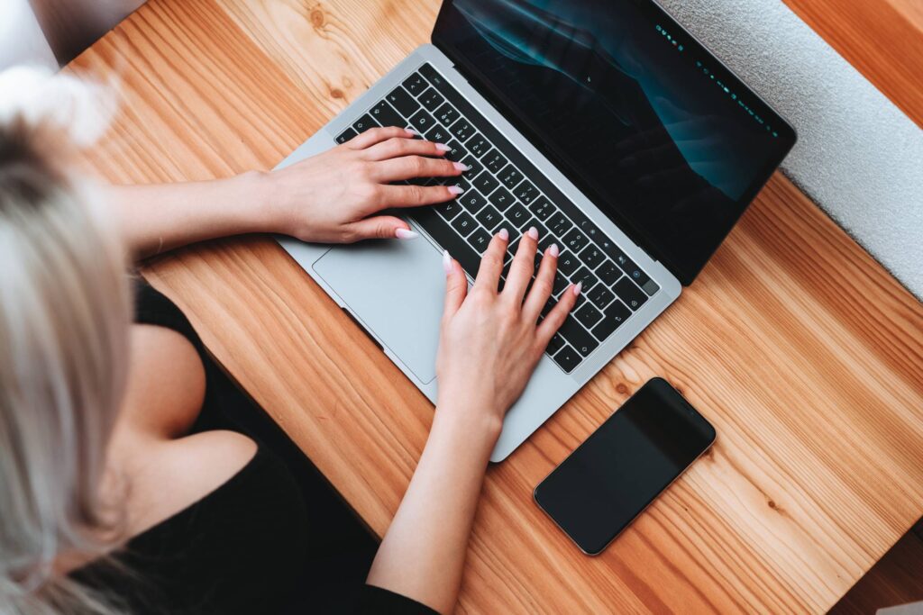 Woman Working on MacBook Free Photo