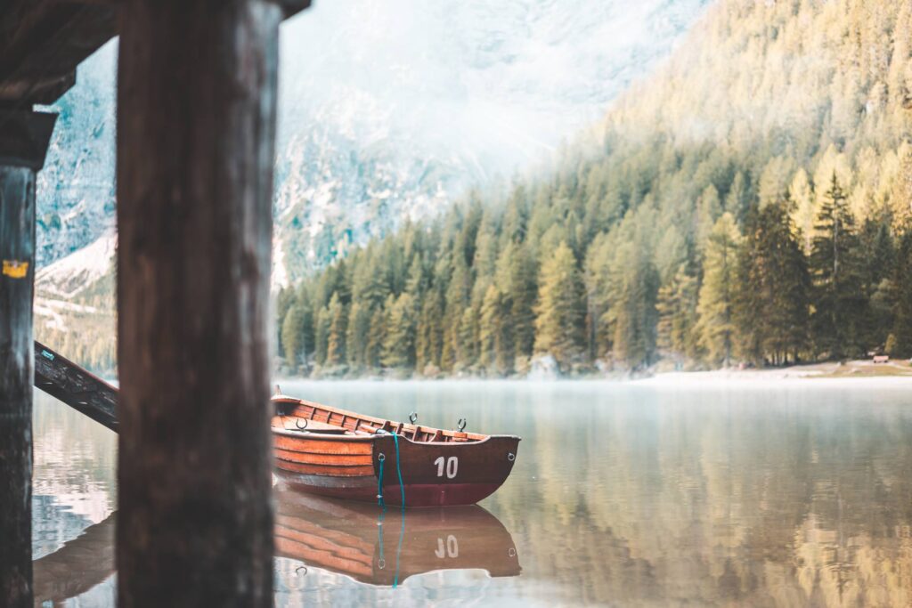 Wooden Rowing Boat on a Lake in the Morning Free Photo