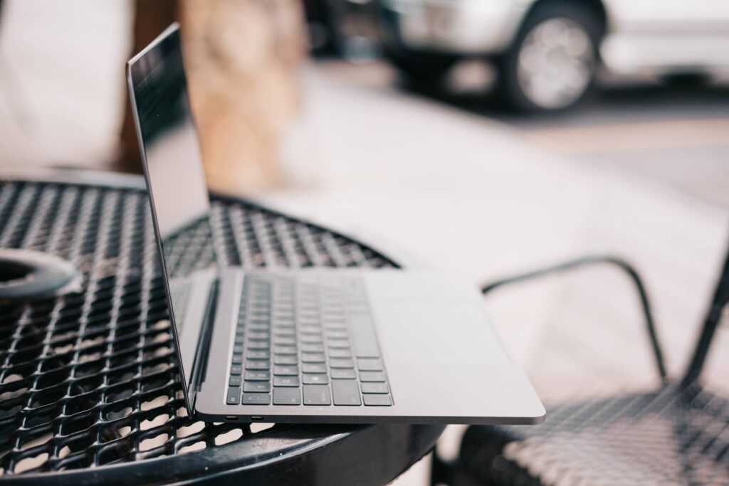 Working on a Laptop Outside on Sunny Evening Free Photo