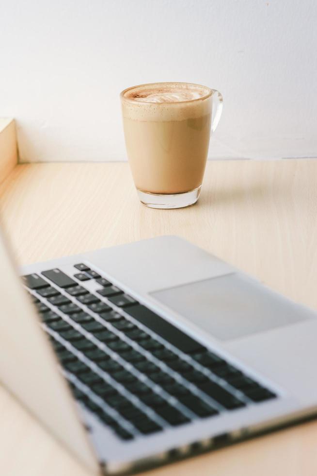 Workspace in the cafe with computer laptop and latte coffee, lifestyle and business concept Stock Free