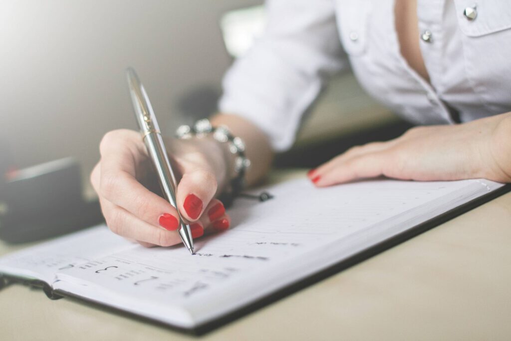 Writing in a Diary Close-Up Free Photo