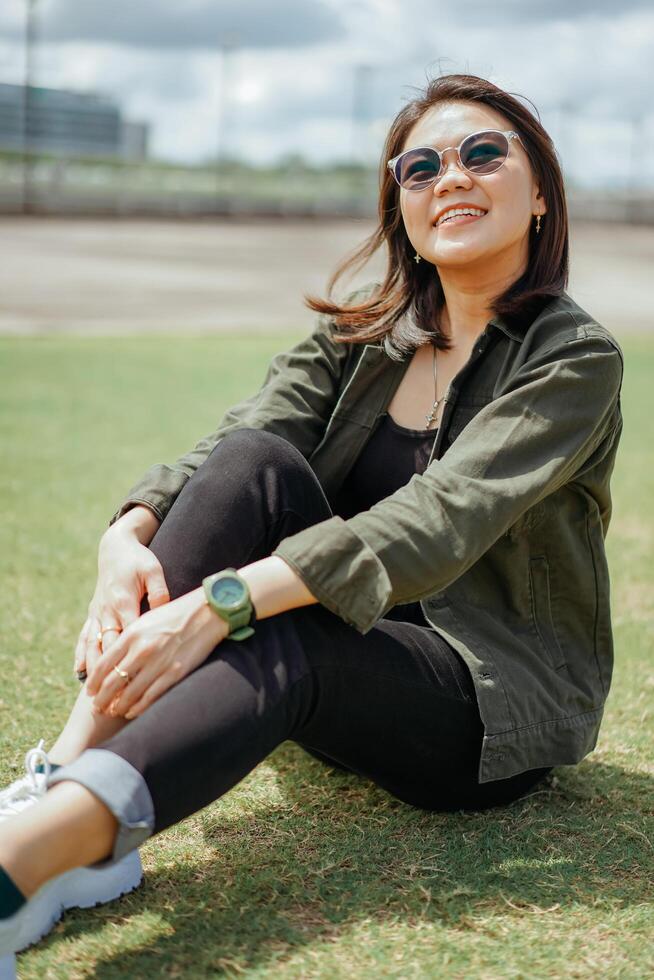 Young Beautiful Asian Woman Wearing Jacket And Black Jeans Posing Outdoors Stock Free