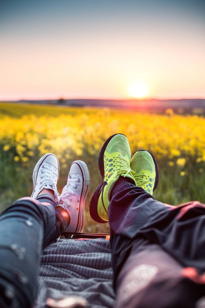 Young Couple Enjoying Sunset in a Car Trunk Free Photo