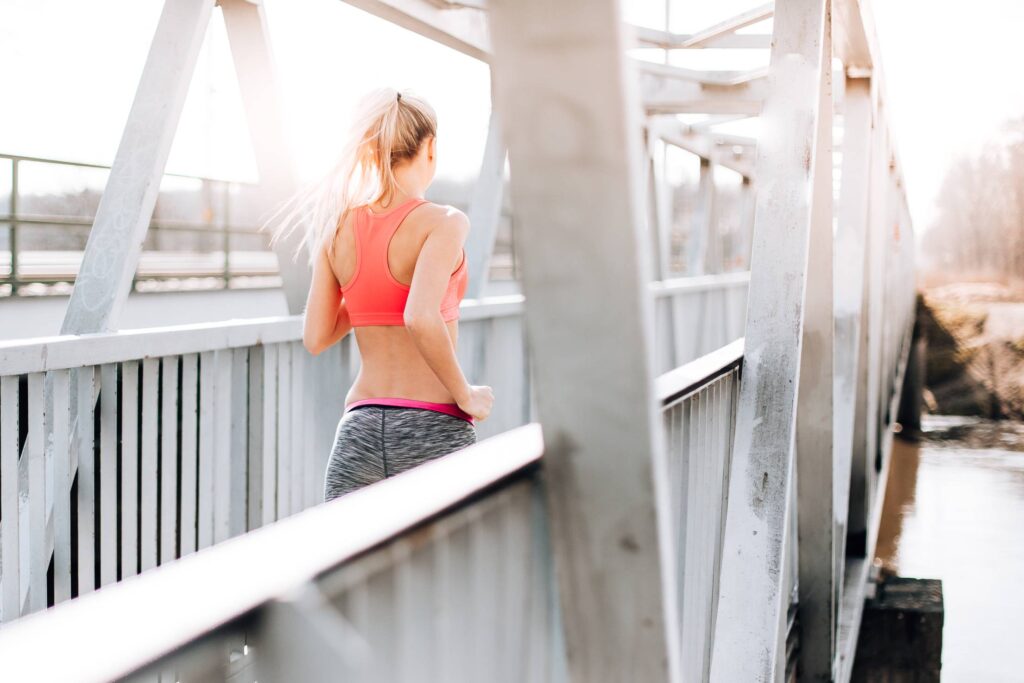 Young Fit Woman on Morning Jogging Run Free Photo