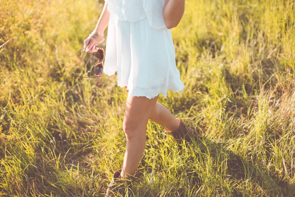 Young Girl Enjoying Her Free Time In a Sunny Meadow Free Photo