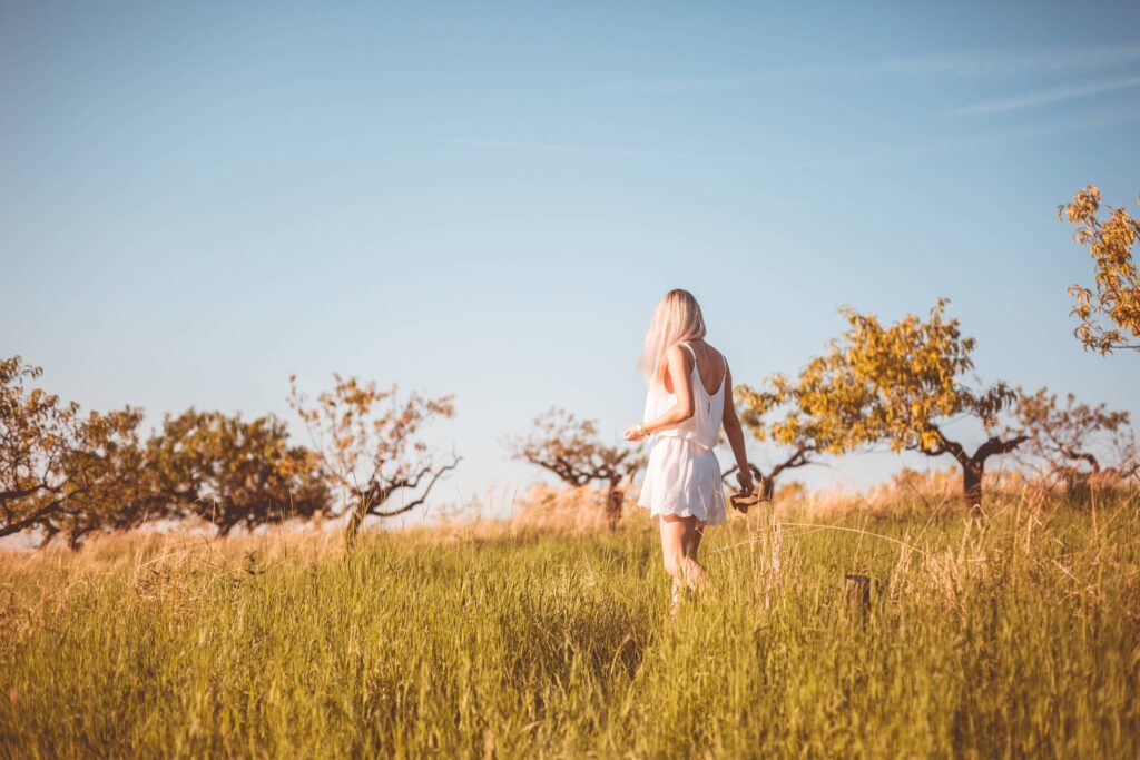 Young Girl Lost in a Meadow Free Photo