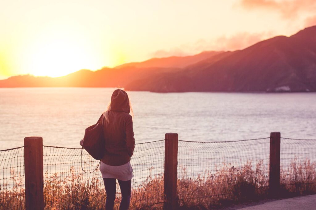 Young Girl on a Walk Near The Shore at Sunset #2 Free Photo