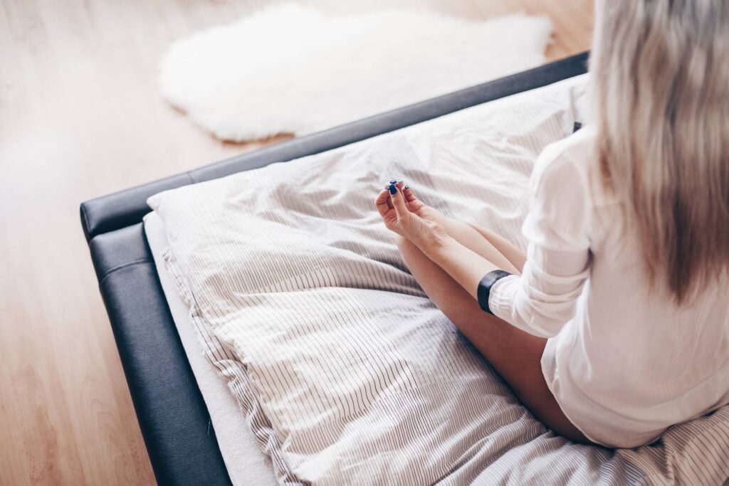 Young Girl Starting New Day with Meditation in Her Bed Free Photo