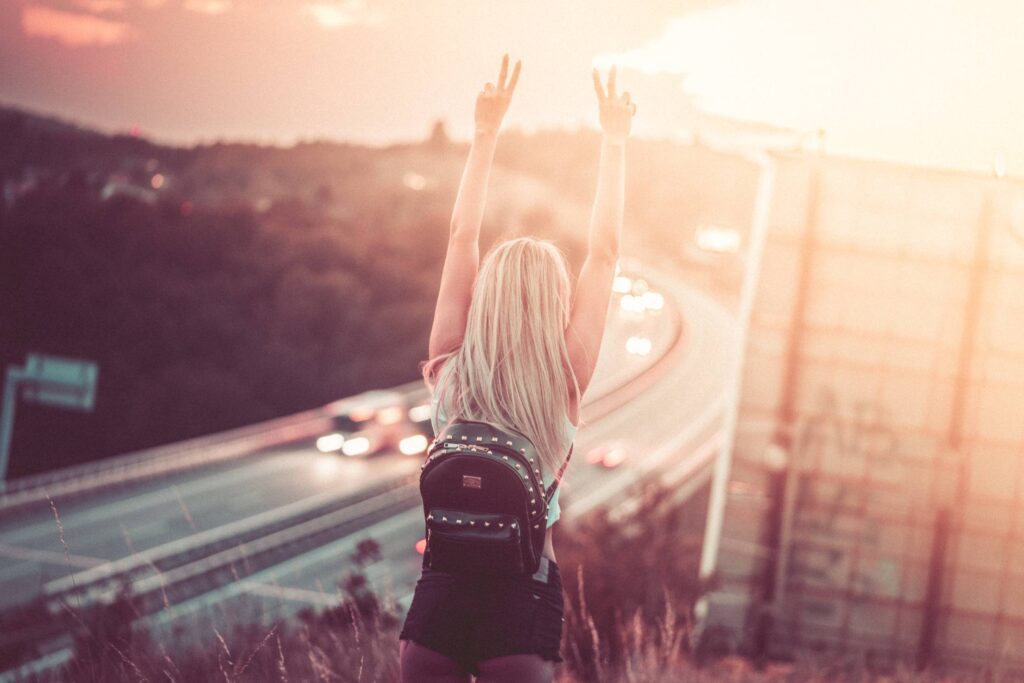 Young Happy Woman Enjoying Freedom on a Walk Free Photo