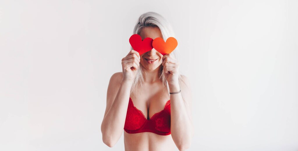 Young Happy Woman with Valentine’s Day Hearts Free Photo