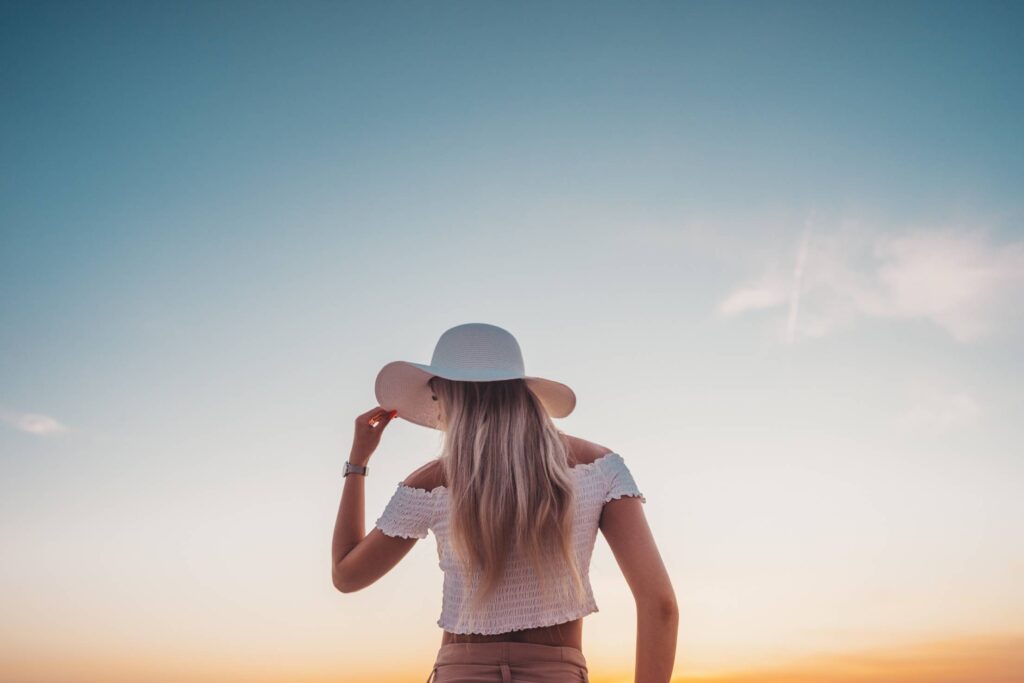 Young Woman Against Blue Evening Sky Free Photo