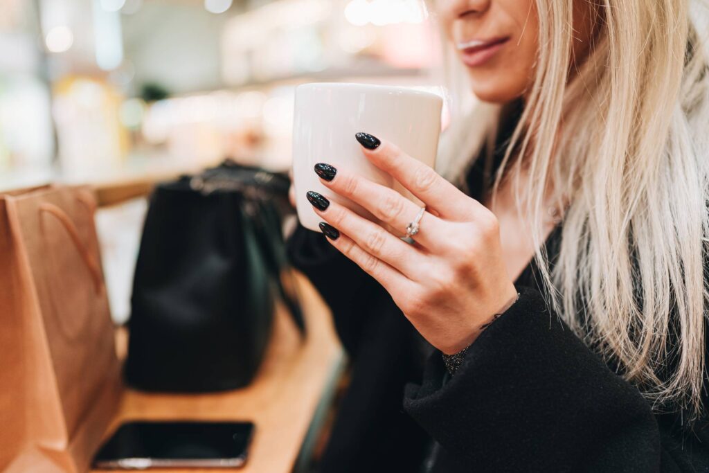 Young Woman Drinking Cappuccino Free Photo