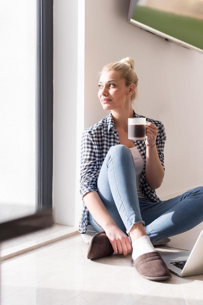 young woman drinking coffee enjoying relaxing lifestyle Stock Free