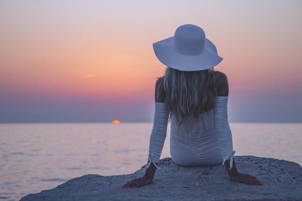 Young Woman Enjoying Amazing Sunset Free Photo