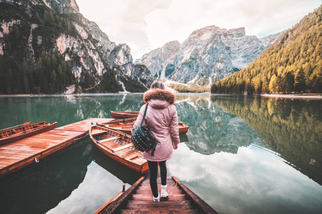 Young Woman Enjoying Beautiful Scenery of Lago di Braies, Italy Free Photo