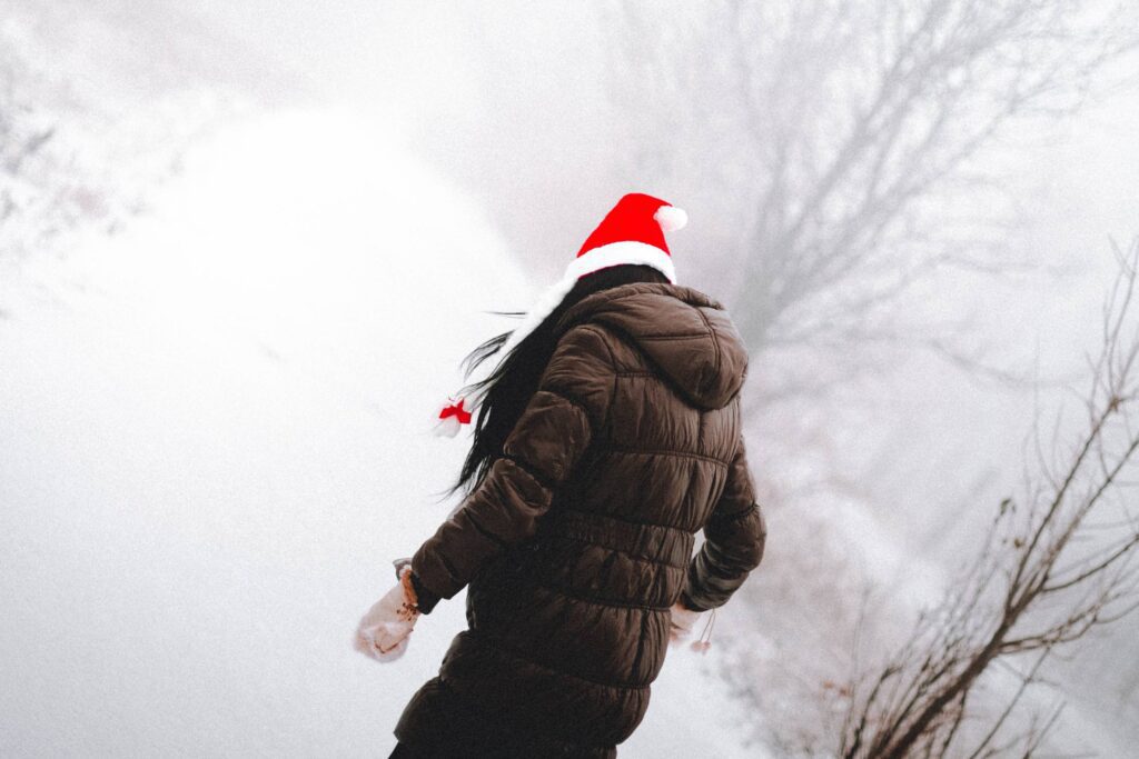 Young Woman Enjoying Christmas Time Free Photo