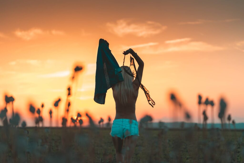 Young Woman Enjoying Freedom and Throwing Her Bra Away Free Photo