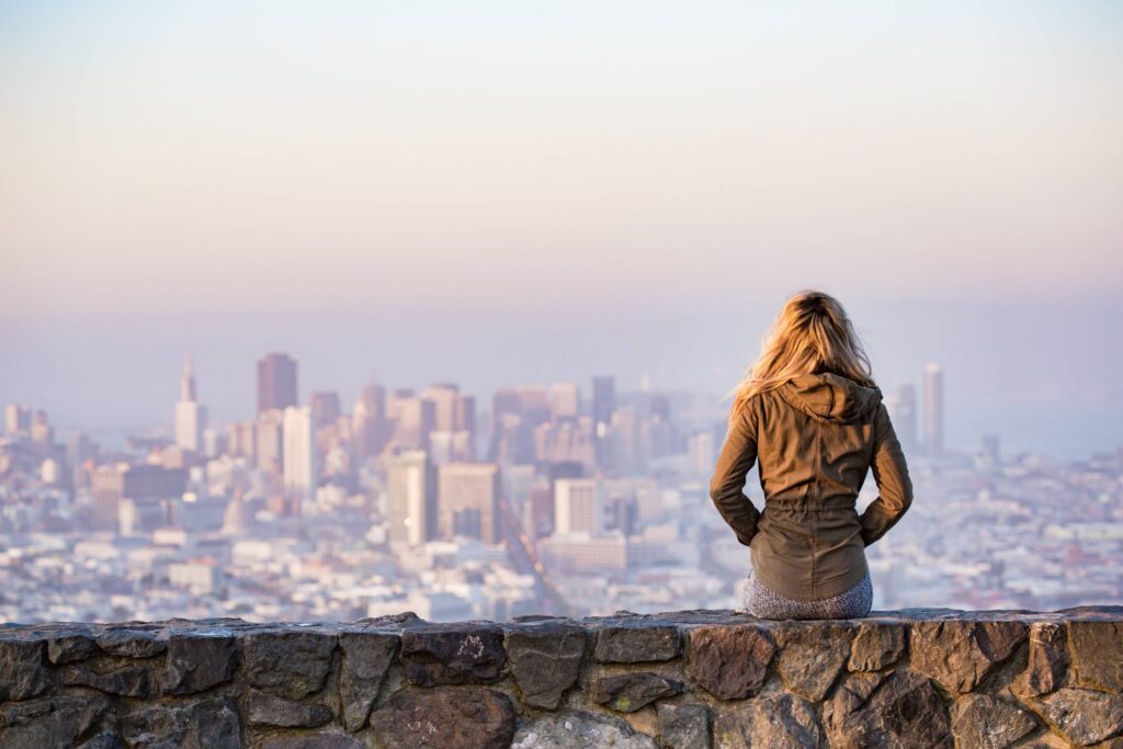 Young Woman Enjoying Moment and Looking Over the San Francisco Free Photo