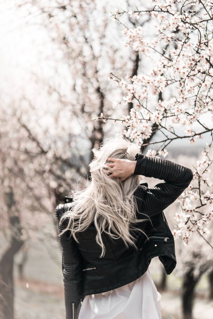 Young Woman Enjoying Moments in Almond Orchard Free Photo