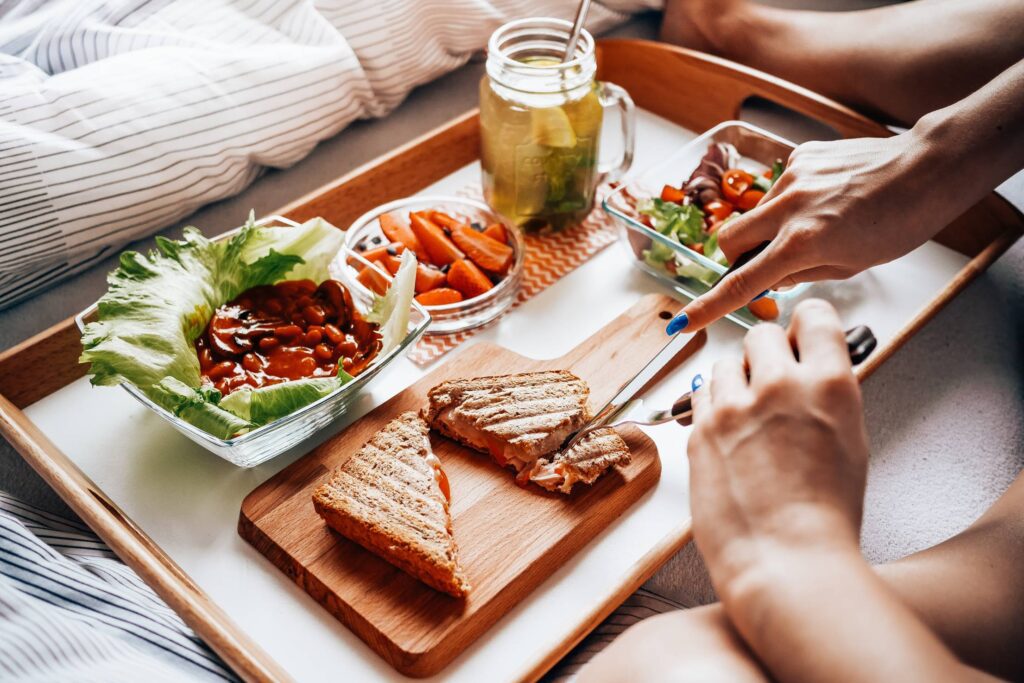 Young Woman Enjoying Morning Breakfast in Bed #2 Free Photo