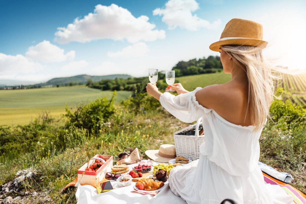 Young Woman Holding Glasses of Prosecco Free Photo