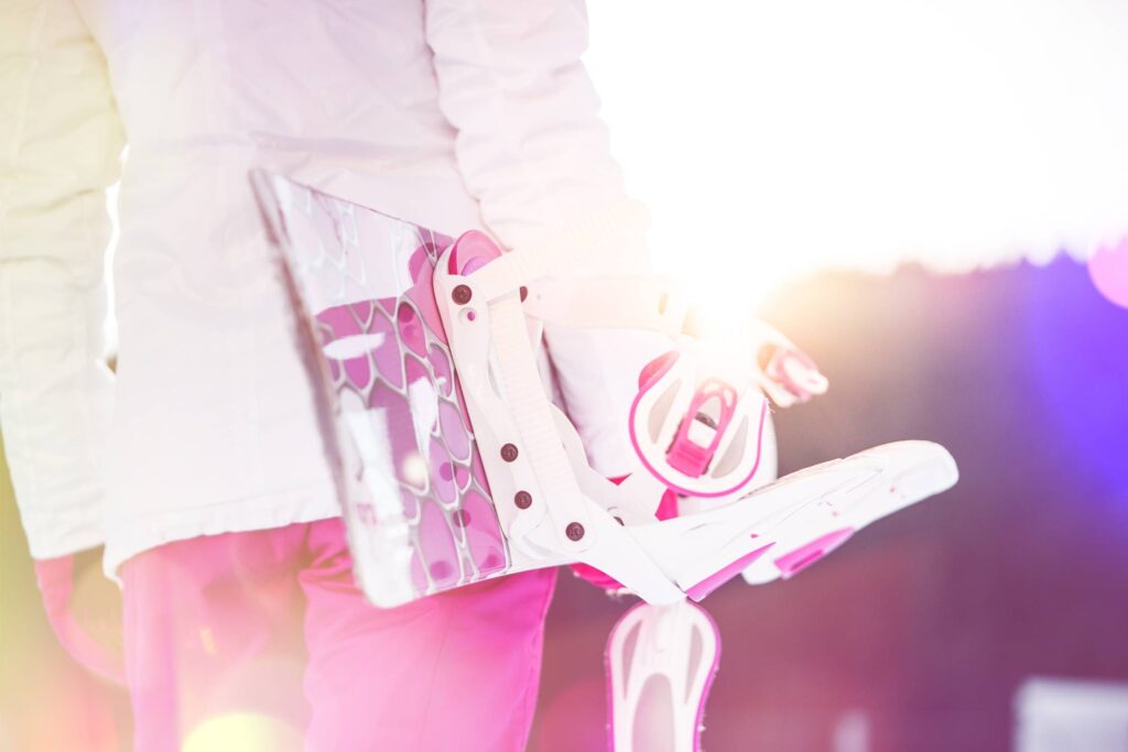 Young Woman Holding Her Pink Snowboard Free Photo