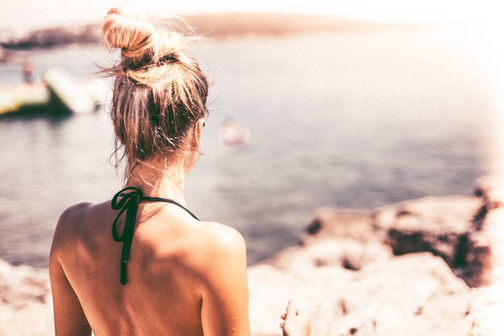 Young Woman in Swimsuit Standing Near Sea Free Photo