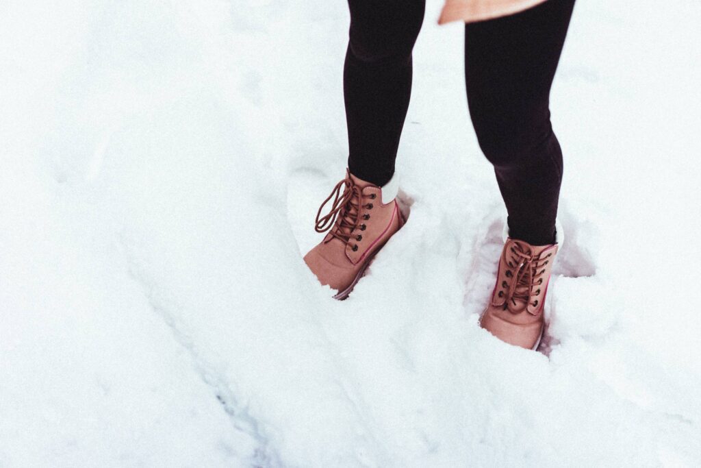 Young Woman in Winter Shoes in Snow Free Photo