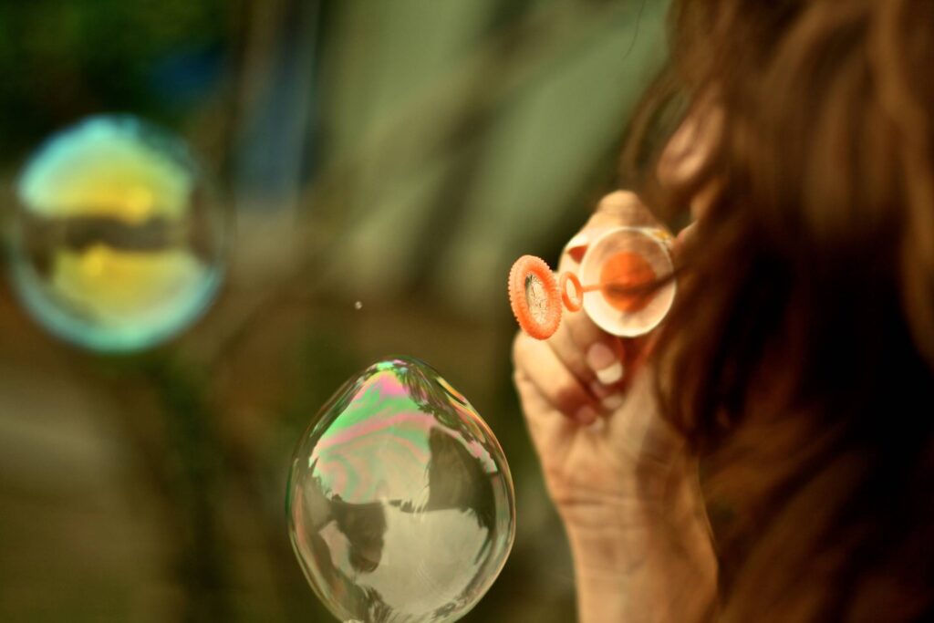 Young Woman Making Bubbles Free Photo