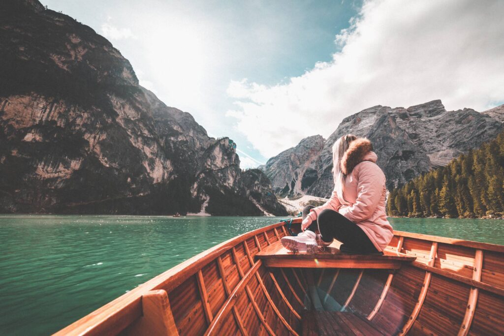 Young Woman Relaxing on a Rowing Boat & Enjoying the Nature Free Photo