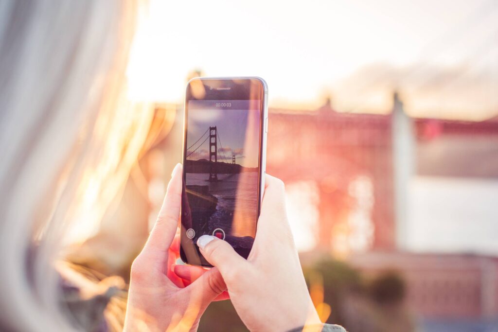 Young Woman Taking a Video of The Golden Gate Bridge Free Photo