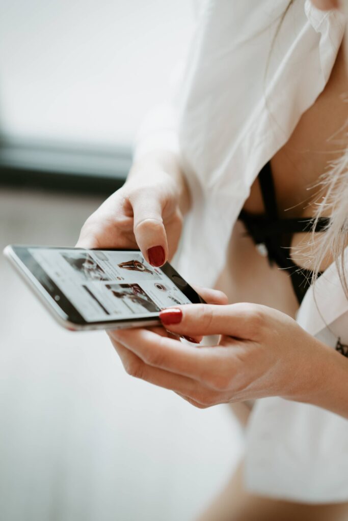 Young Woman Using iPhone in the Morning Free Photo