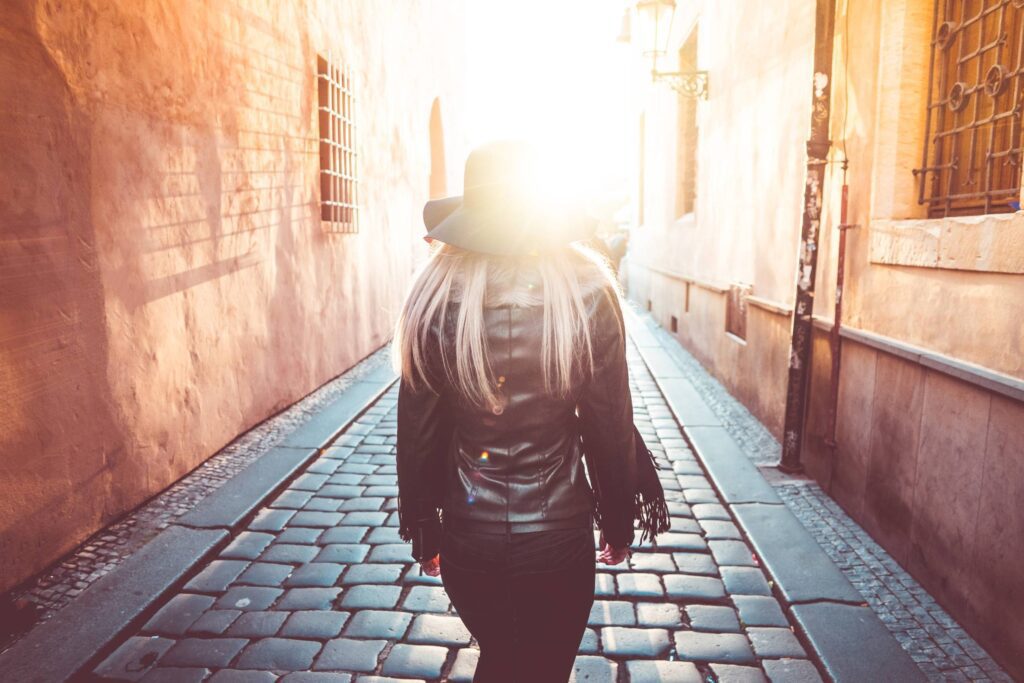 Young Woman Walking Alone in Prague Streets Free Photo