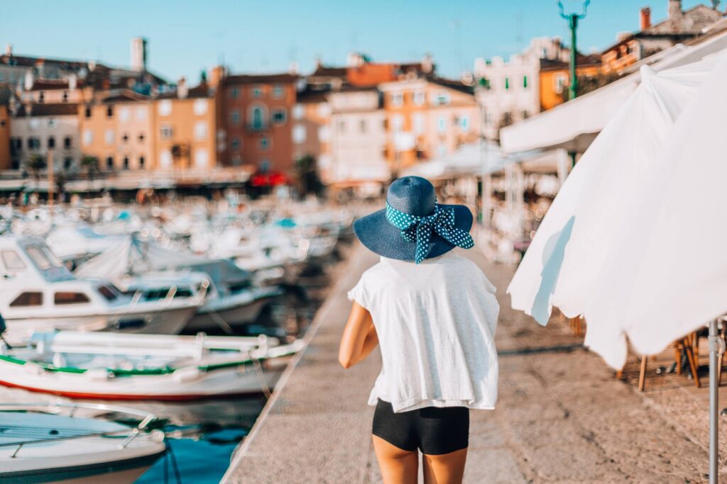 Young Woman Walking Around The Harbor in Croatia Free Photo