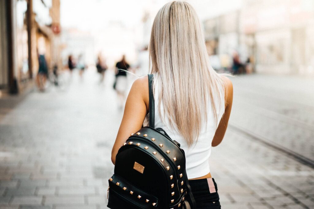 Young Woman Walking on The Street in The City Free Photo