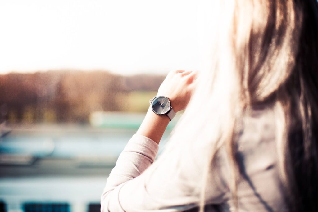 Young Woman with Gray Fashion Watches Enjoying Views Free Photo