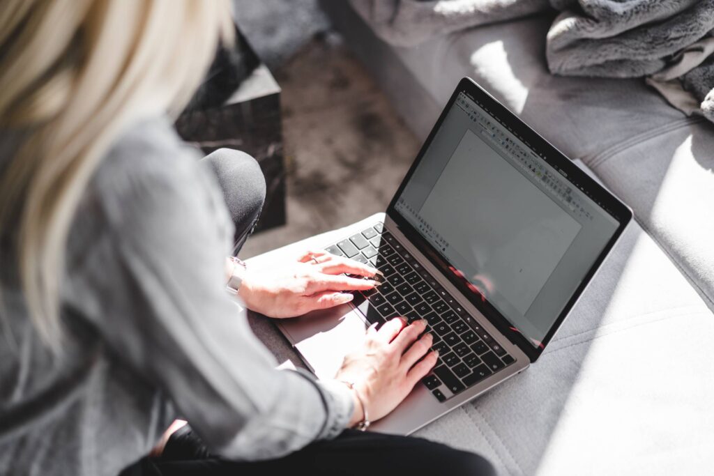 Young Woman Working with Writing App on Her Laptop Free Photo