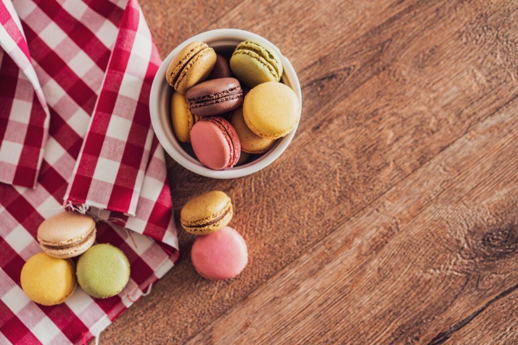 Yummy Colorful Macarons on Wooden Table Free Photo